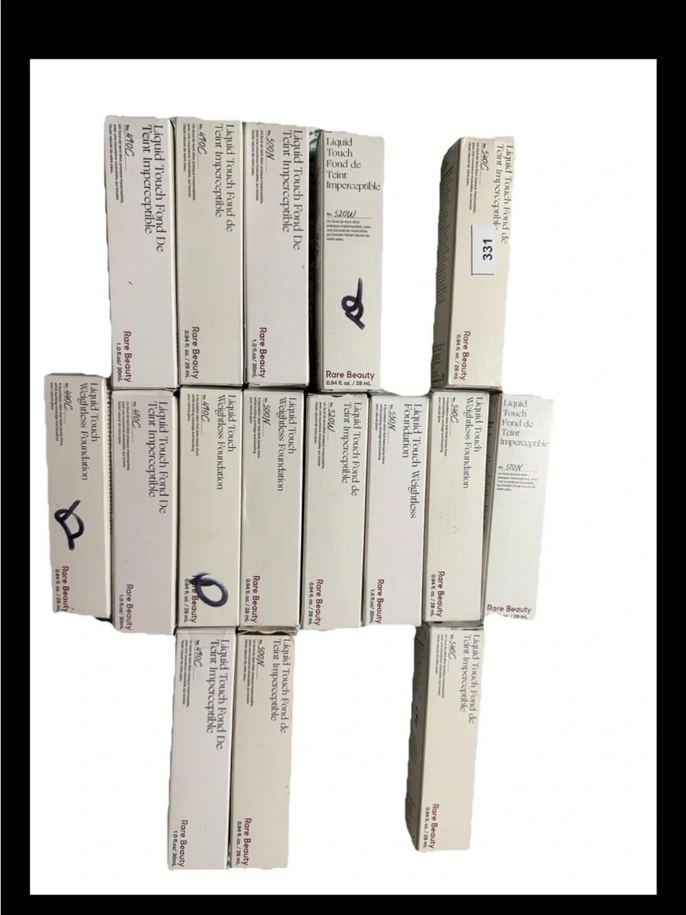 Rare Beauty Liquid Touch Foundation Boxes in brown and tan Shades